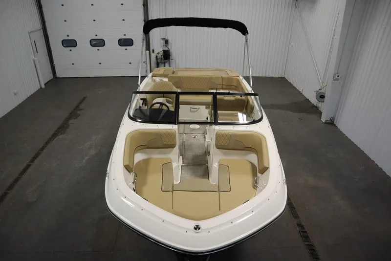 Slide: The Image of 2024 Bayliner VR5 Bowrider in a garage, showcasing spacious seating and sleek design. - 7