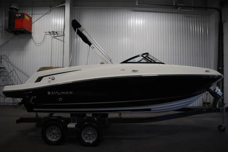 Slide: The Image of 2024 Bayliner VR5 Bowrider boat on trailer in indoor storage facility. - 9