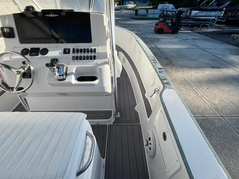 Slide: The Image of 2003 Pro-Line 25 Sport CC boat interior with steering wheel and control panel. - 12