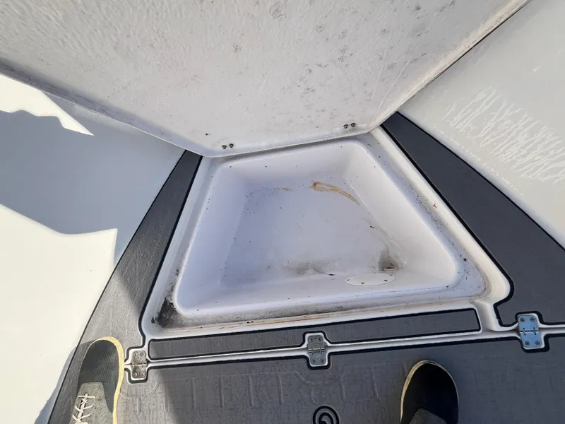 Slide: The Image of Open storage compartment on 2003 Pro-Line 25 Sport CC boat deck. - 24