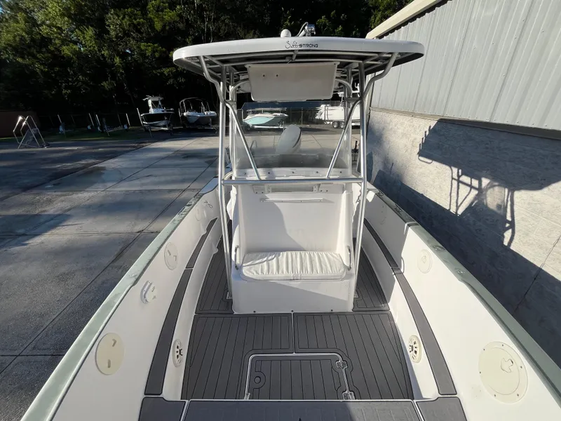 Slide: The Image of 2003 Pro-Line 25 Sport CC boat with T-top and spacious deck. - 26