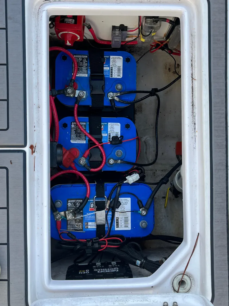 Slide: The Image of Battery compartment of a 2003 Pro-Line 25 Sport CC boat with wiring and connections. - 7
