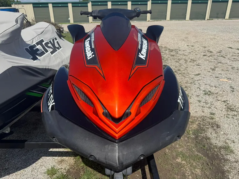 Slide: The Image of Red 2015 Kawasaki 310lx jet ski parked outdoors on gravel. - 3