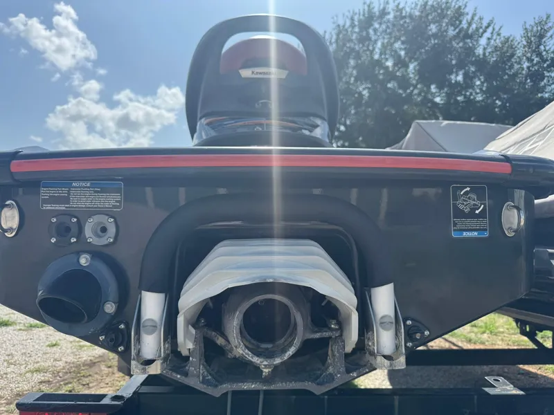 Slide: The Image of Rear view of a 2015 Kawasaki 310lx jet ski under a sunny sky. - 5