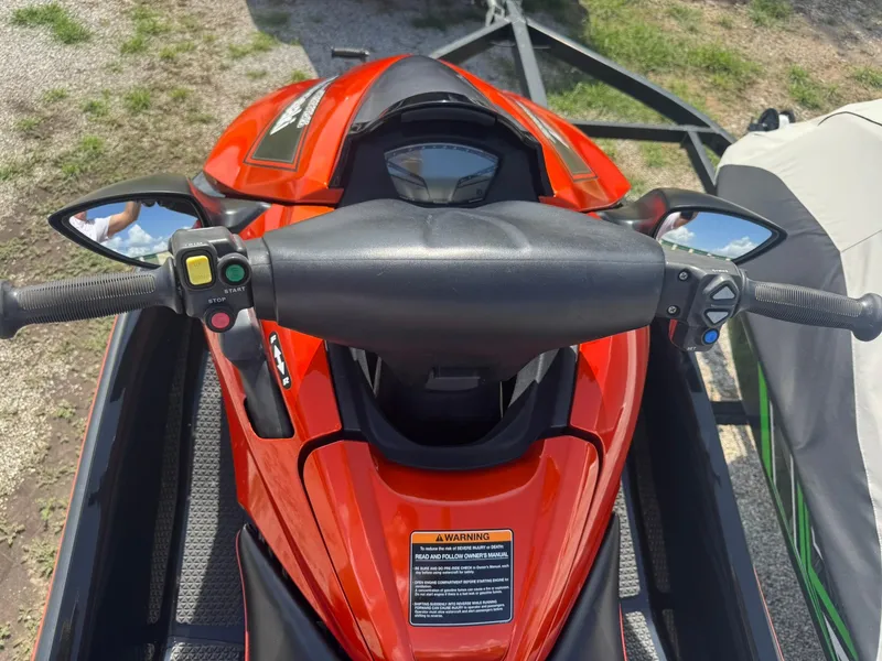Slide: The Image of 2015 Kawasaki 310lx jet ski, red, top view of handlebars and controls. - 8