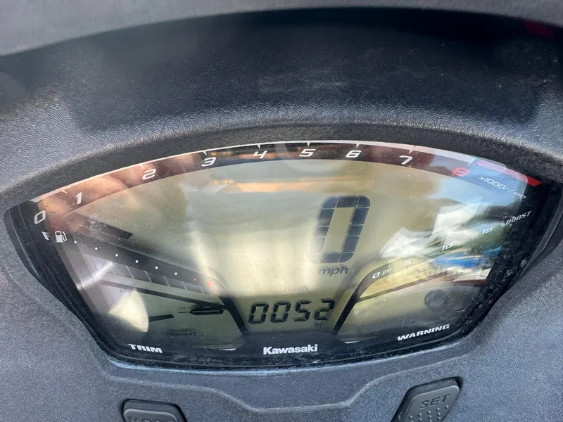 Slide: The Image of Close-up of a 2015 Kawasaki 310lx speedometer displaying 0 mph and 52 hours. - 9