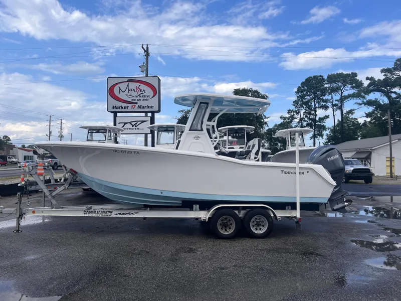 Slide: The Image of 2023 Tidewater 232 CC Adventure boat on trailer at Marker 17 Marine dealership. - 0