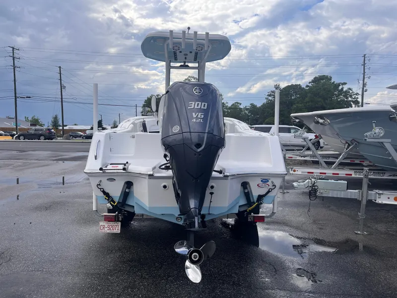 Slide: The Image of 2023 Tidewater 232 CC Adventure boat with Yamaha 300 V6 engine, parked outdoors. - 3
