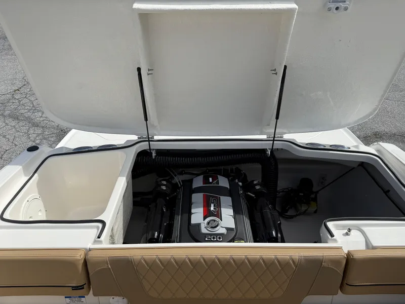 Slide: The Image of 2025 Bayliner VR4 Bowrider I/O engine compartment with open hatch, showcasing engine details. - 14