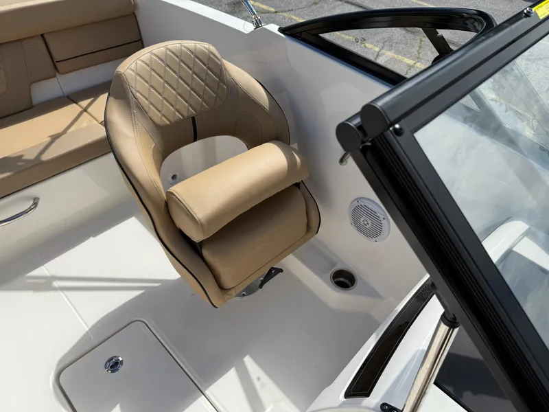 Slide: The Image of 2025 Bayliner VR4 Bowrider I/O interior with tan seating and modern design. - 5