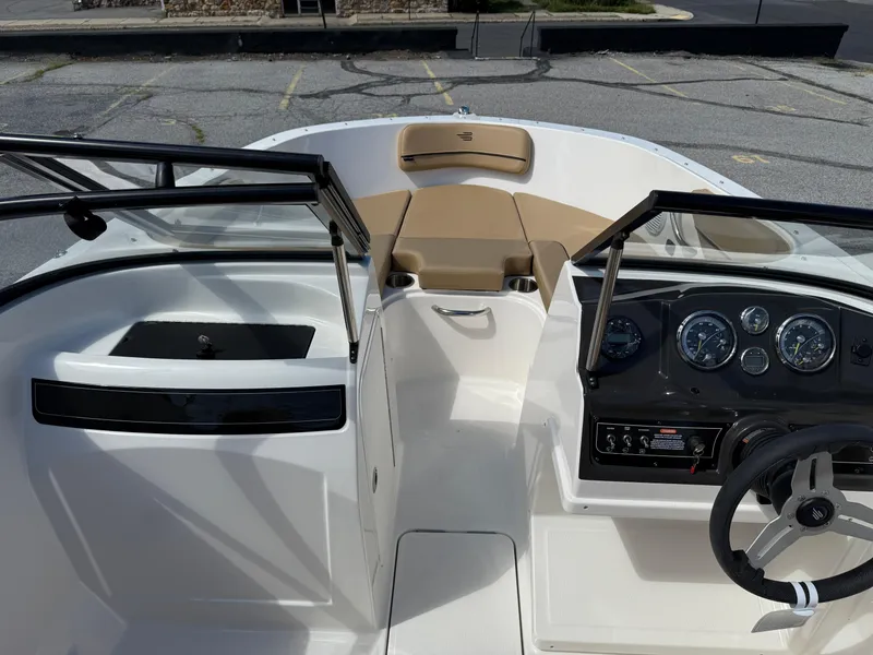 Slide: The Image of 2025 Bayliner VR4 Bowrider I/O interior with dashboard and seating area. - 9