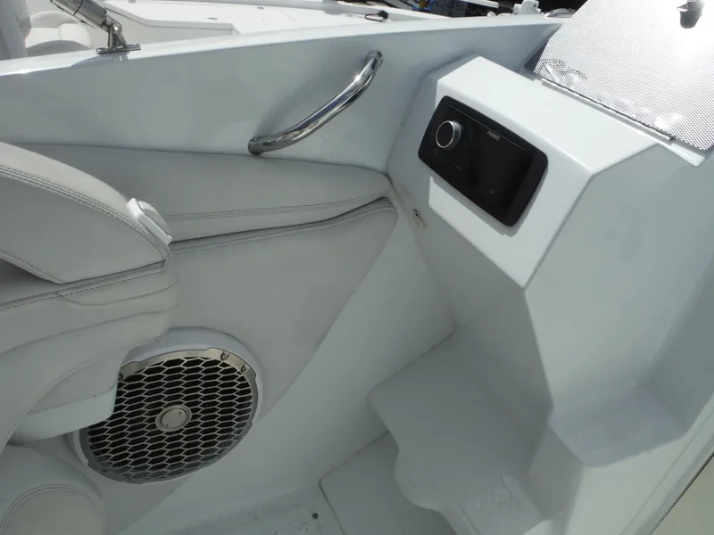 Slide: The Image of Interior of 2003 Baja 36 Outlaw boat featuring speaker and control panel. - 15