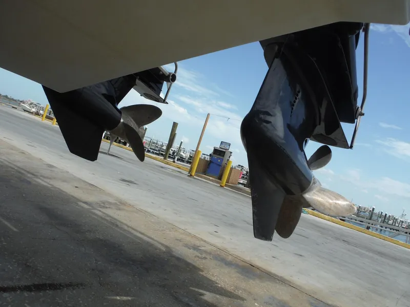 Slide: The Image of 2003 Baja 36 Outlaw boat propellers at a marina dockside. - 48