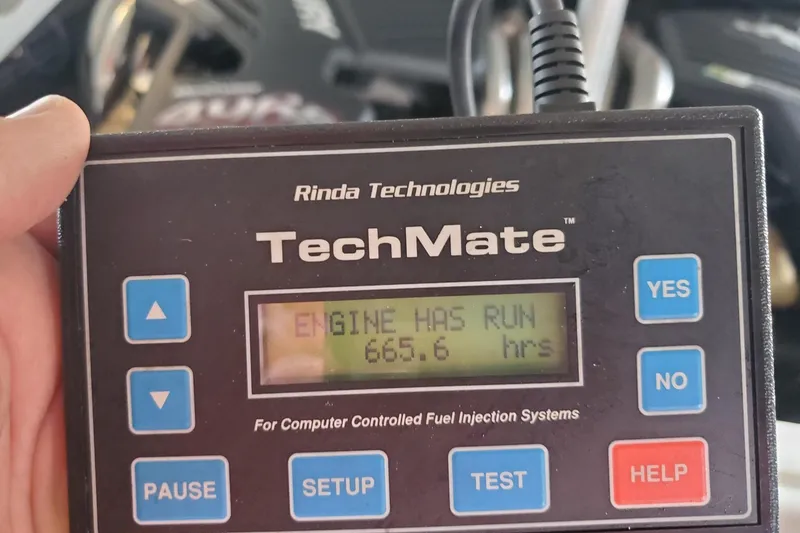Slide: The Image of Rinda TechMate device showing 665.6 engine hours for 2003 Baja 36 Outlaw. - 56