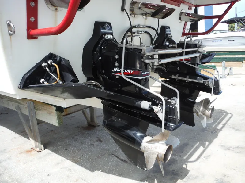 Slide: The Image of 2003 Baja 36 Outlaw boat with dual Mercury outboard engines and stainless steel propellers. - 8