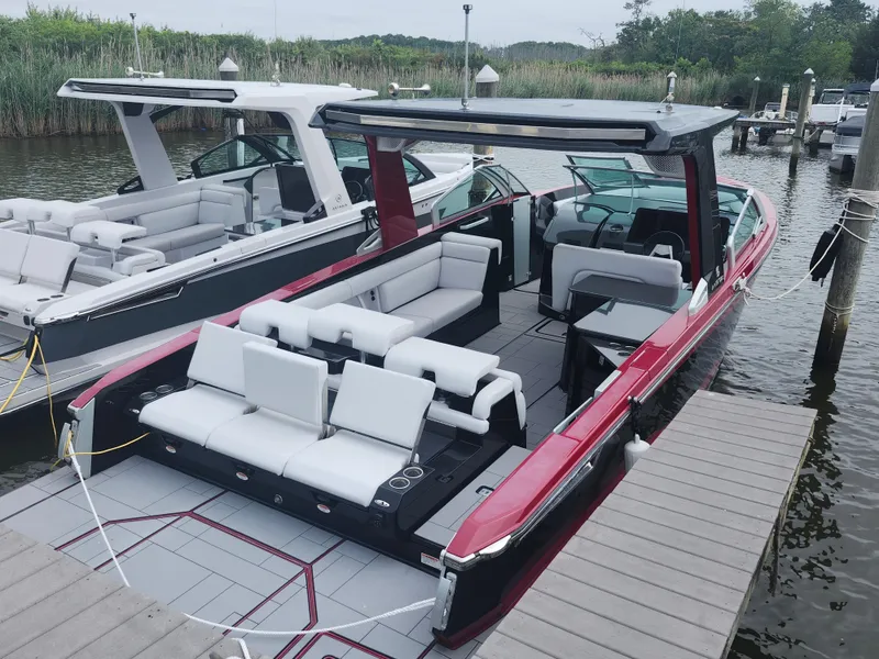 Slide: The Image of Luxury 2020 Aviara AV32 I/O boat docked, featuring spacious seating and sleek design. - 2