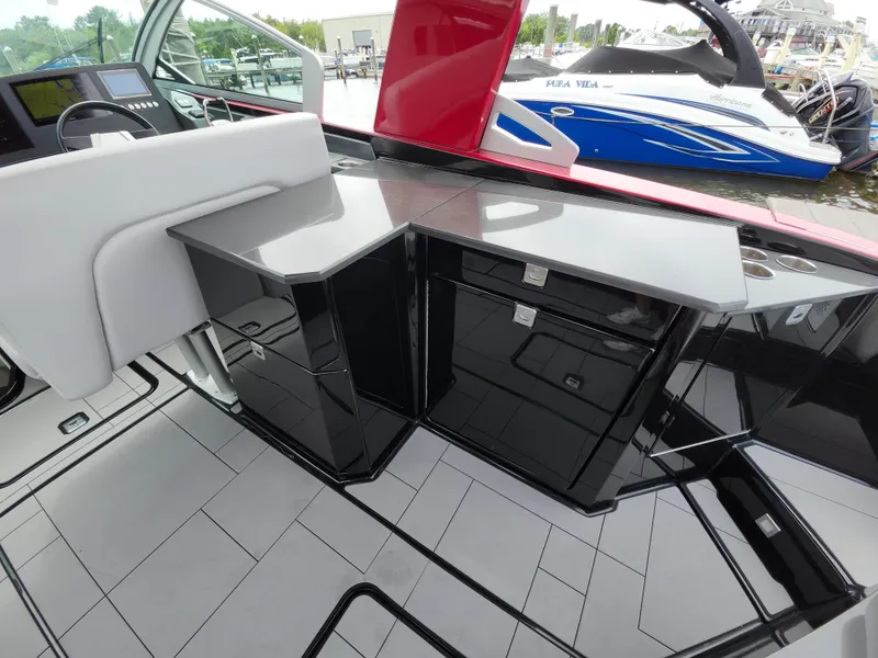 Slide: The Image of 2020 Aviara AV32 I/O boat interior with sleek black cabinetry and modern design. - 21
