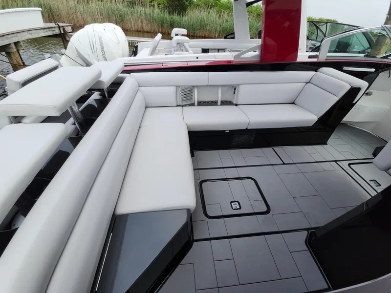 Slide: The Image of Luxurious seating area on a 2020 Aviara AV32 I/O boat, featuring sleek design and modern upholstery. - 22