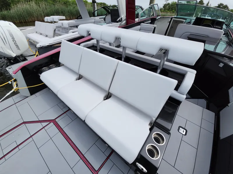 Slide: The Image of 2020 Aviara AV32 I/O boat interior with white seating and modern design. - 24