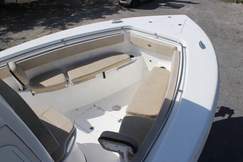 Slide: The Image of 2023 Sea Pro 259 Deep V CC boat with beige seating and spacious deck layout. - 10