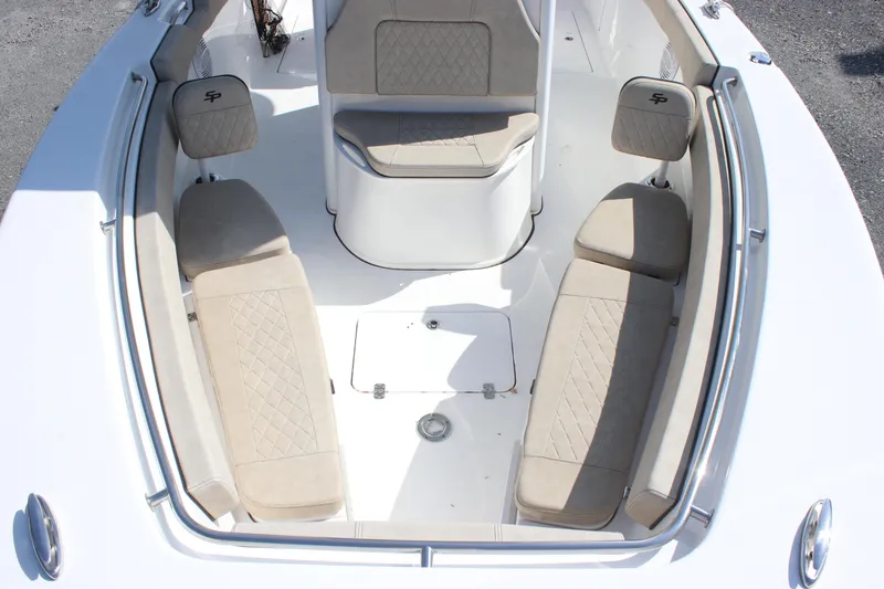 Slide: The Image of 2023 Sea Pro 259 Deep V CC boat interior with beige seating and storage compartments. - 4