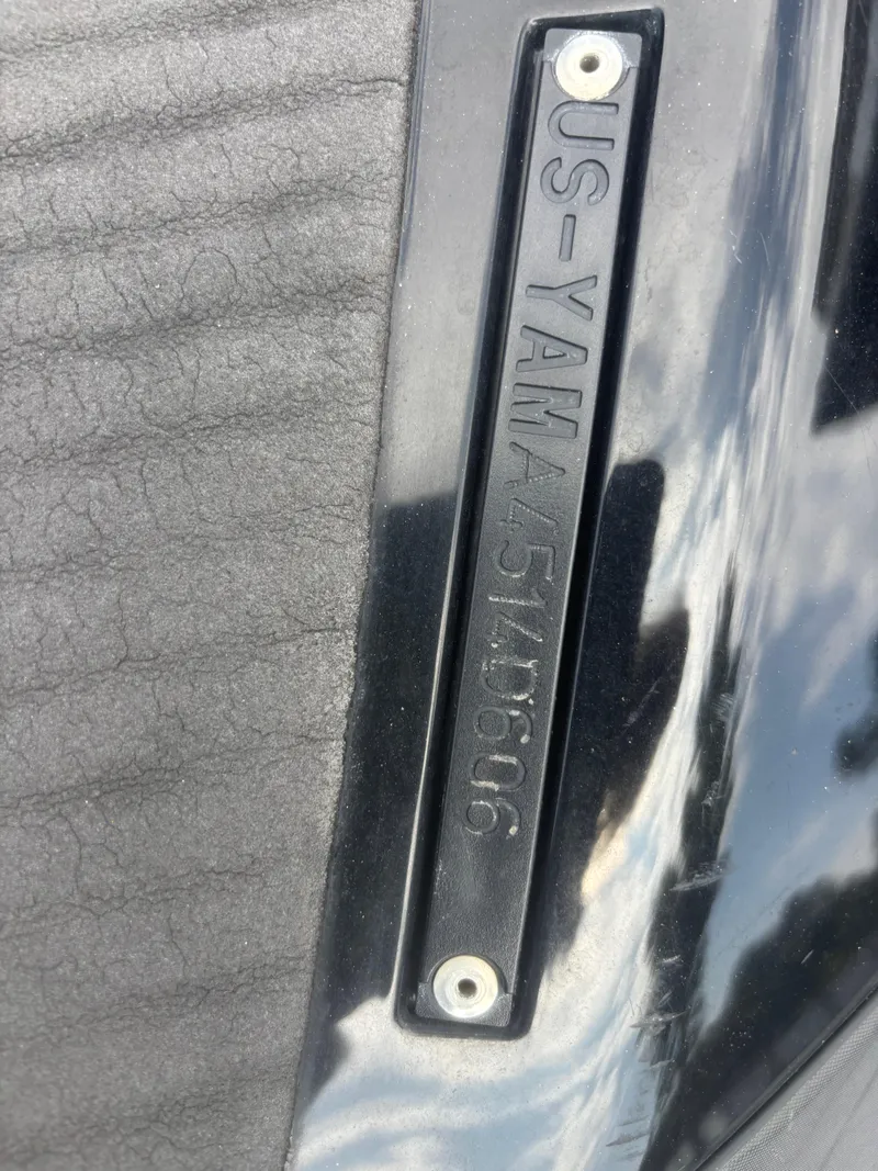Slide: The Image of 2006 Yamaha WaveRunner FX HO identification plate on black surface. - 10