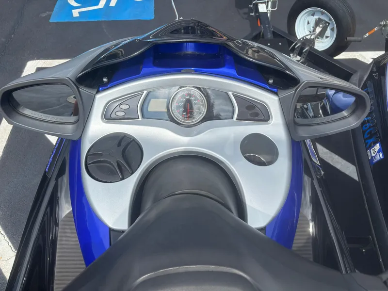 Slide: The Image of 2006 Yamaha WaveRunner FX HO dashboard with speedometer and mirrors, parked on pavement. - 4