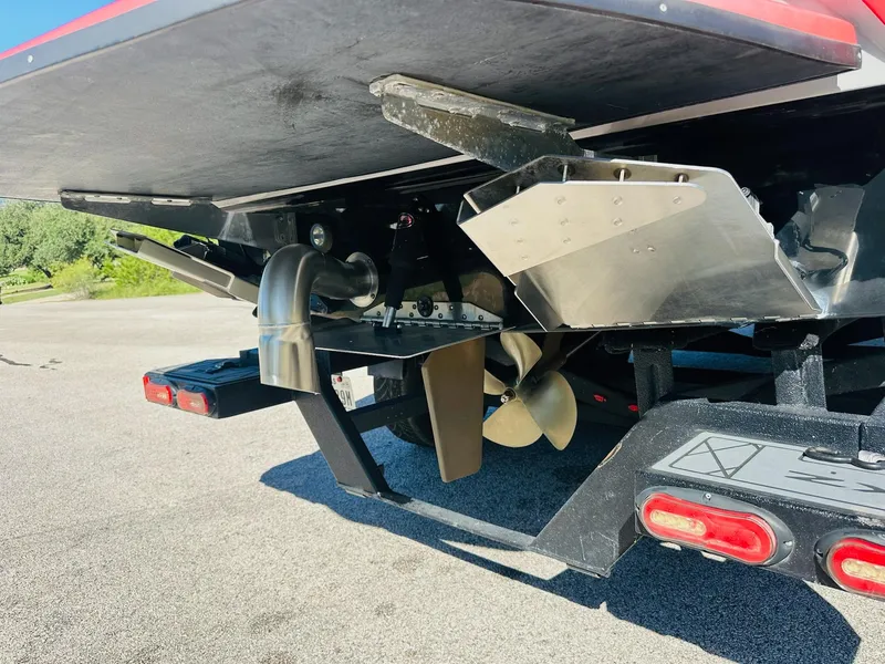 Slide: The Image of 2020 Tigé 25ZX boat underside showing propeller and exhaust system. - 12