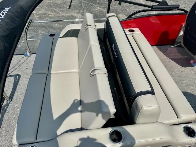 Slide: The Image of 2026 Barletta C24UC boat with beige seating and cup holders. - 10