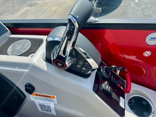 Slide: The Image of Control panel of 2026 Barletta C24UC boat with throttle and warning label. - 7