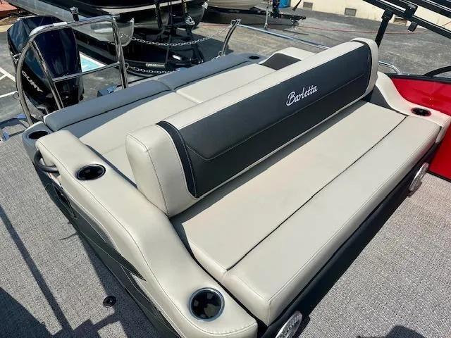 Slide: The Image of 2026 Barletta C24UC boat with comfortable seating and cup holders. - 8