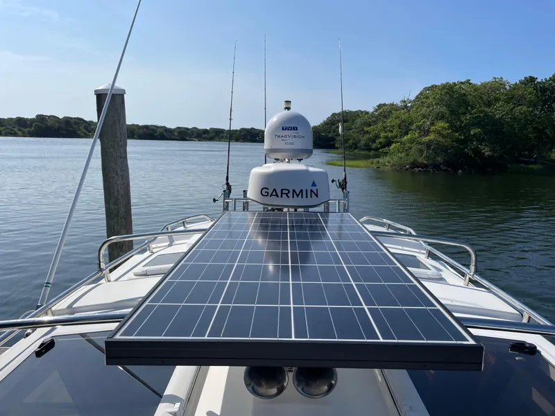 Slide: The Image of 2017 Cutwater C-28 boat with solar panel and Garmin radar on calm water. - 20