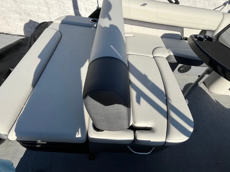 Slide: The Image of 2025 Starcraft EXS-3 boat interior with gray seating and black table. - 11