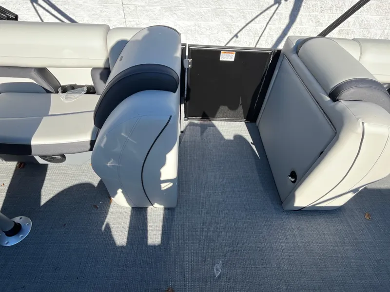 Slide: The Image of 2025 Starcraft EXS-3 boat interior with gray seating and flooring. - 15
