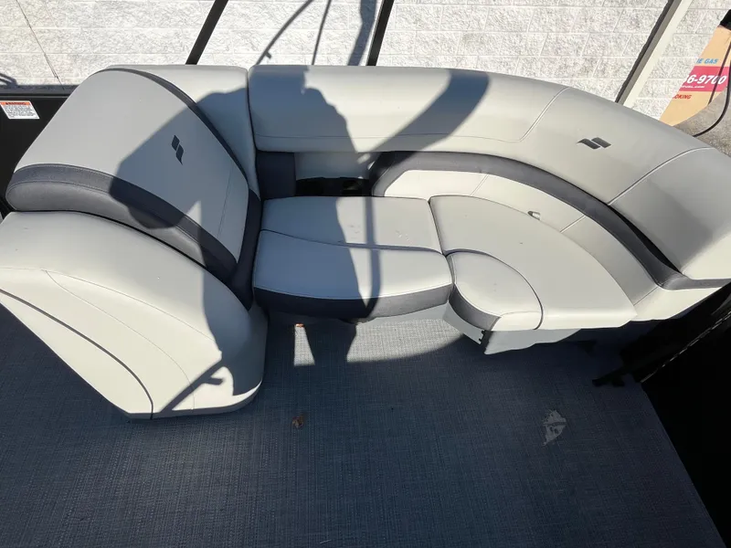 Slide: The Image of 2025 Starcraft EXS-3 boat seating, featuring modern gray upholstery and curved design. - 18