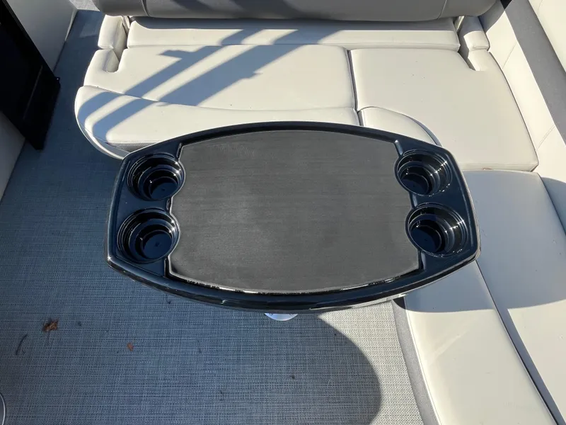 Slide: The Image of Starcraft EXS-3 2025 boat interior with cup holders and seating. - 28