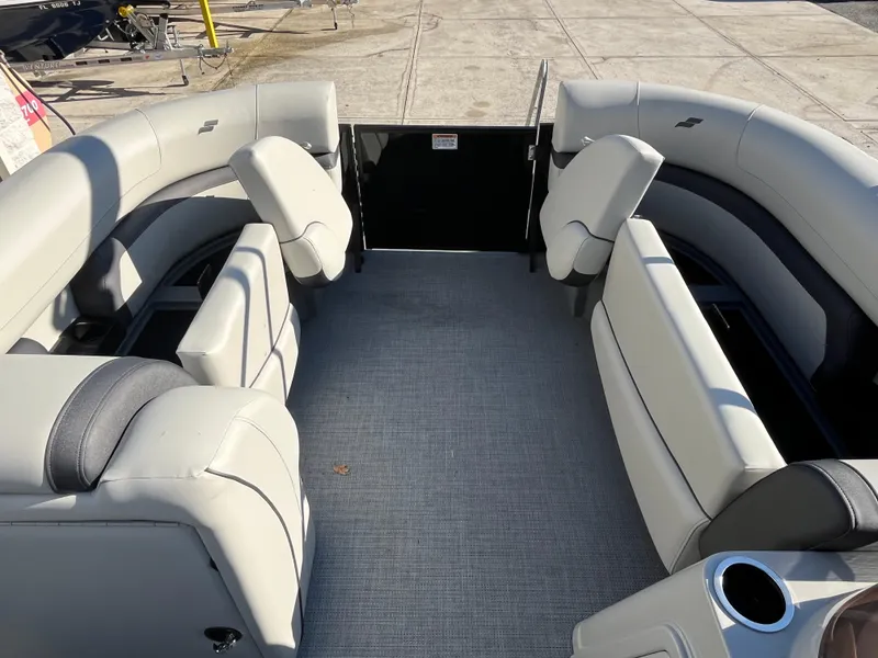 Slide: The Image of 2025 Starcraft EXS-3 boat interior with gray seating and spacious layout. - 29