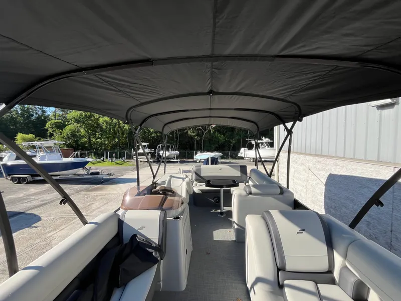 Slide: The Image of 2025 Starcraft EXS-3 boat interior with canopy, featuring spacious seating and modern design. - 31