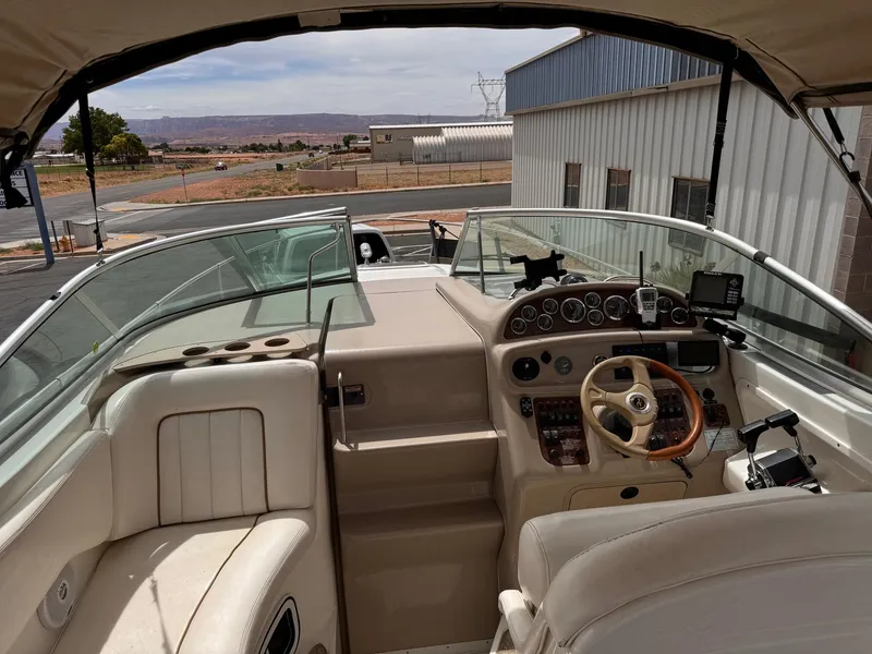 Slide: The Image of Interior view of 2001 Sea Ray 270 Sundancer boat cockpit with steering wheel and controls. - 20