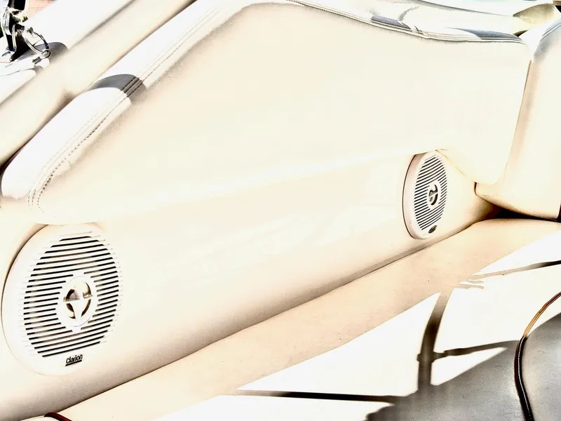 Slide: The Image of Interior speakers of a 2001 Sea Ray 270 Sundancer boat, featuring Clarion audio system. - 24