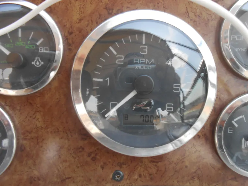 Slide: The Image of Close-up of 2001 Sea Ray 270 Sundancer dashboard with RPM gauge. - 26