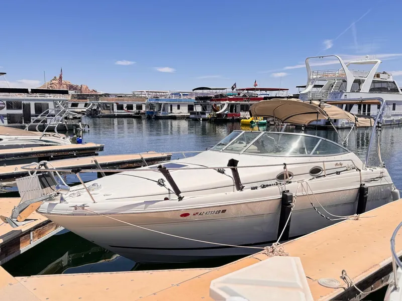 Slide: The Image of 2001 Sea Ray 270 Sundancer docked at marina under clear blue sky. - 3