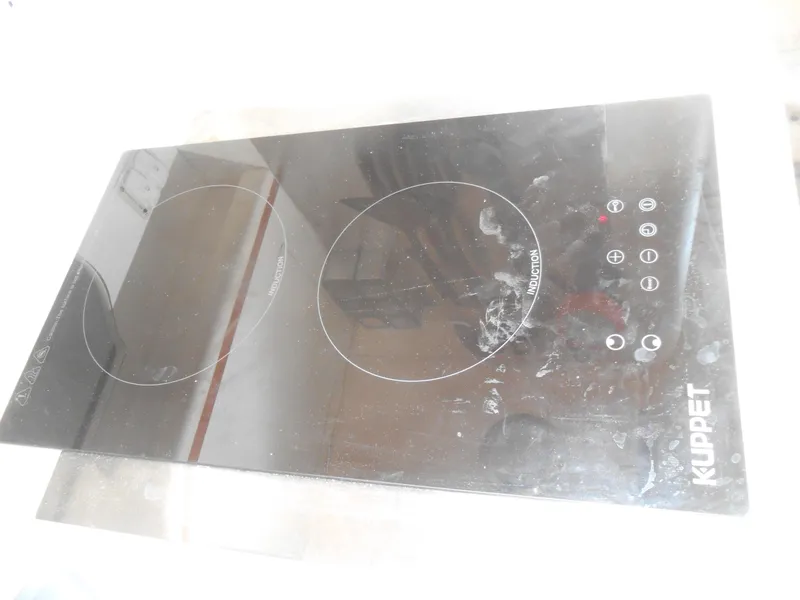 Slide: The Image of KUPPET induction cooktop with dual burners, featuring touch controls and sleek design. - 30