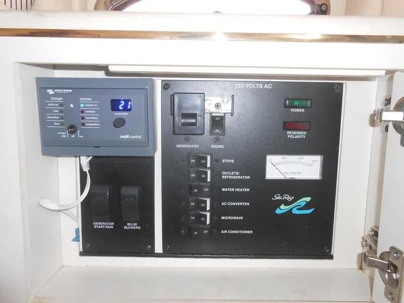 Slide: The Image of Control panel of a 2001 Sea Ray 270 Sundancer boat, showing electrical systems and settings. - 33