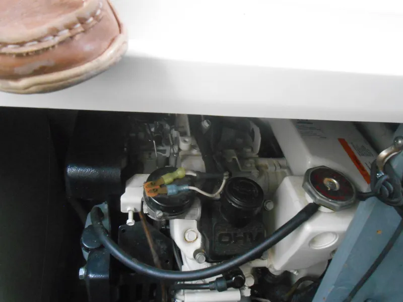 Slide: The Image of Engine compartment of a 2001 Sea Ray 270 Sundancer boat, partially visible. - 36