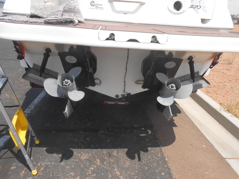 Slide: The Image of Rear view of 2001 Sea Ray 270 Sundancer boat with dual propellers. - 39