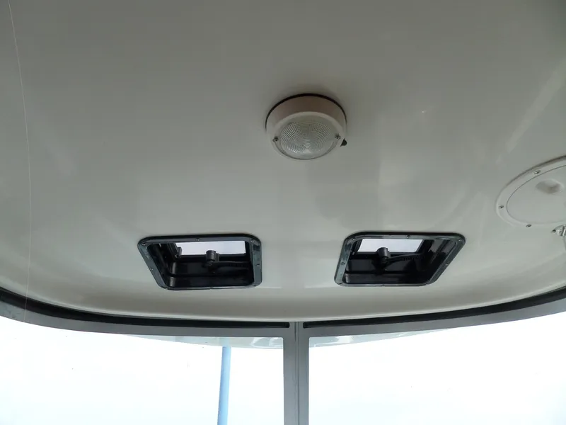 Slide: The Image of 2005 Seaswirl Striper boat interior ceiling with hatches and light fixture. - 28