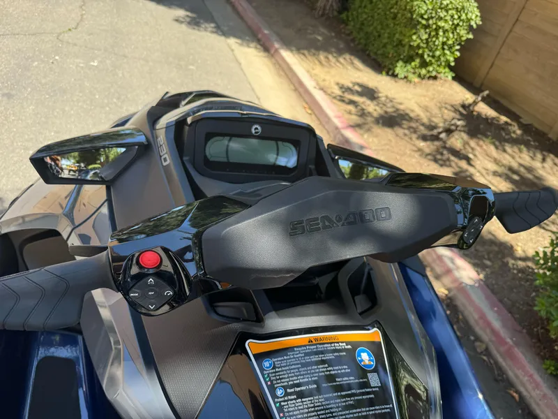 Slide: The Image of 2025 Sea-Doo GTX 230 handlebars and dashboard, showcasing sleek design and controls. - 3