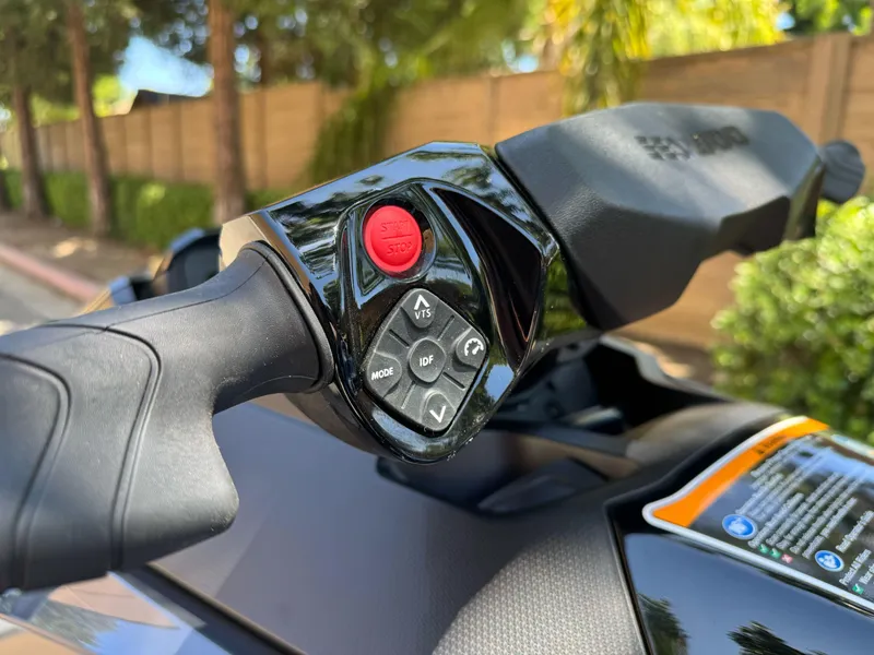 Slide: The Image of Close-up of 2025 Sea-Doo GTX 230 handlebar controls with start/stop button. - 4