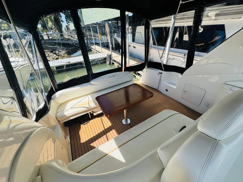 Slide: The Image of Luxurious interior of 2000 Sea Ray 340 Sundancer yacht with seating and table. - 10